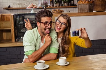Funny couple taking a selfie 