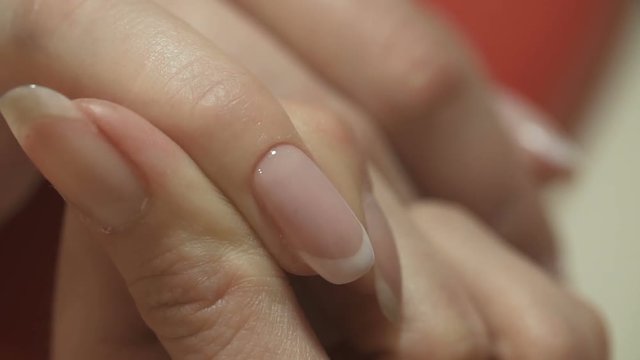 Manicure. Nail Polish. Woman in a Beauty Salon receiving a manicure by a beautician