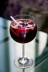Beautiful festive cocktail with strawberries and ice in the glass