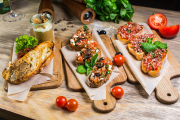 Beautiful fresh sandwiches with meat pate with vegetables and greens