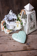 Decorative flower wreath, turquoise heart and decorative lantern