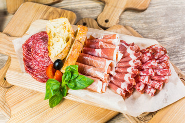Delicious and tasty meat dishes. Ham, salami, prosciutto. Italian appetizers.