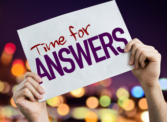 Time for Answers placard with night lights on background
