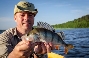 Perch fishing in summer lake