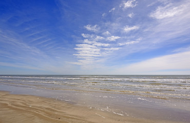 Fototapeta na wymiar Cloud Patterns over an Ocean Beach