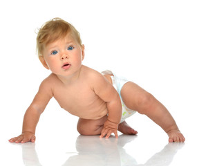 Infant child baby girl in diaper crawling happy smiling