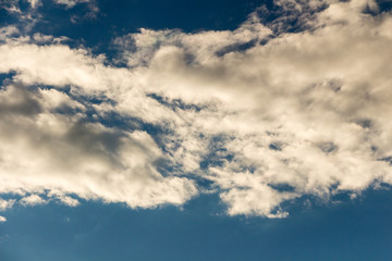 Blue sky with stormy clouds in the summer day