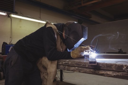 Welder welding a metal