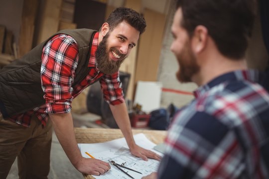 Carpenter working on a blueprint
