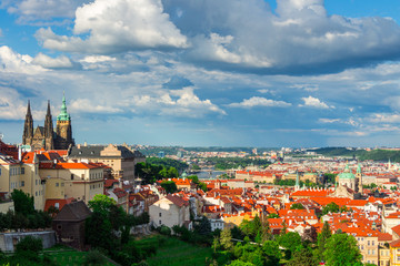 Fototapeta premium Panorama of Prague from Petrin gardens, Castle and St. Vitus cathedral visible of the left, bridges and Vltava river in the background, Czech Republic
