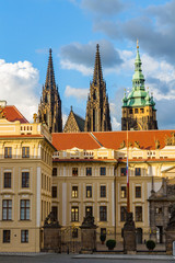 Naklejka premium Main gate to the royal area of historical Prague Castle at sunny day, in the background the St Vitus cathedral, Czech Republic