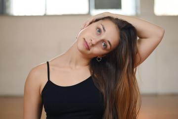 Athlete young woman doing exercise at gym. Indoors.