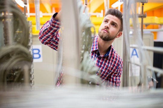 Technician looking at cables of the server