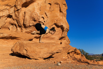 Yoga outdoor on rock in desert