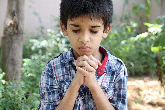 Portrait of Indian Boy Praying