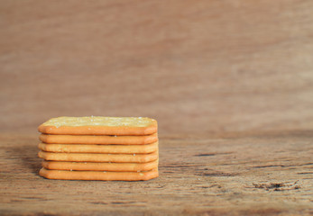 Biscuits with sesame seeds on wood background