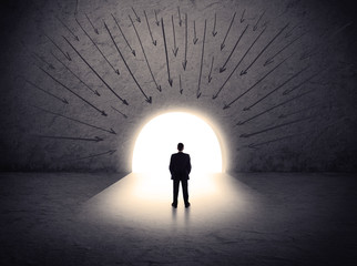 man standing in front of the huge gate