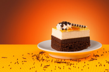 Delicious cake on colorful background with copyspace
