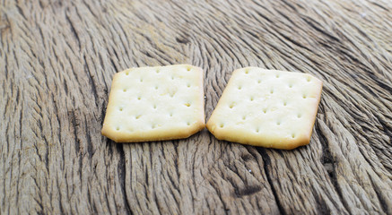 Biscuits with sesame seeds on grunge wood background