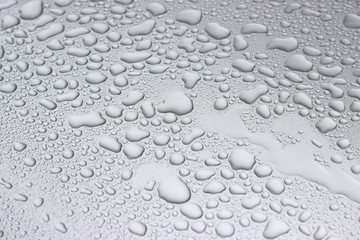  Water drops on a gray metal surface 