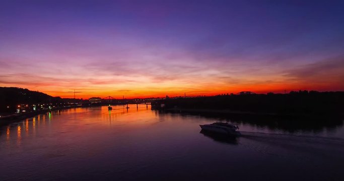beautiful sunset view of the bridge and passing ships.
bridge at Trukhanov Island Kiev.
the right bank of the Dnieper.
sunset in a big city with a river view