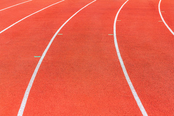 Running track texture. Running track background. Red running track at sport stadium. Athletic running track with copy space for text or image.