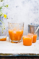 Papaya, orange, carrot, banana and pimpkin iced drink or smoothies.