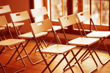 Horizontal orange office chairs bokeh background