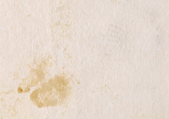 Vintage light paper texture with old spots. Abstract background. 