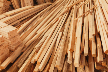 Stacked of wood log for construction buildings background and texture