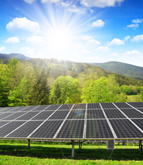 Solar panels in spring landscape. Clean energy.