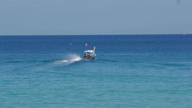 Longtail motor boat in ocean