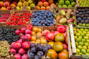 Florence, Italy - September 17, 2015: Fruits and vegetables in boxes for sale in Italian market