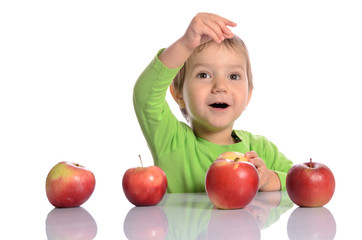 Fototapeta na wymiar Cute child with red apples on white background