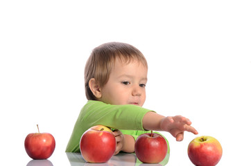 Fototapeta premium Cute child with red apples on white background