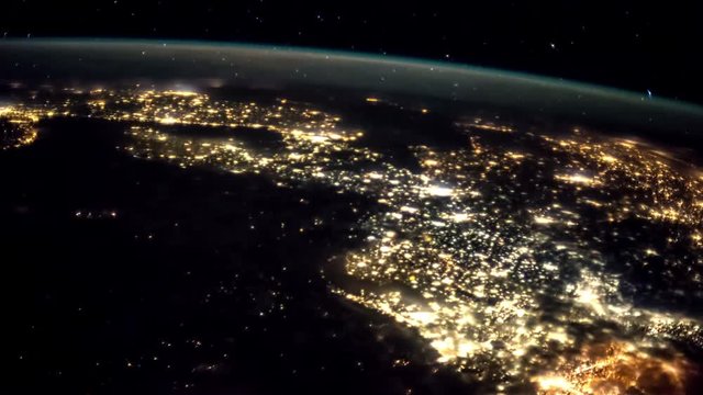 Planet Earth at night seen from the ISS. Elements of this video furnished by NASA