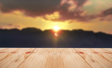 Fototapeta na wymiar Empty table on Sunset in mountain soft blur.