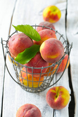 ripe peaches on wooden surface