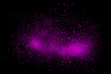 Magenta abstract powder explosion on a black background