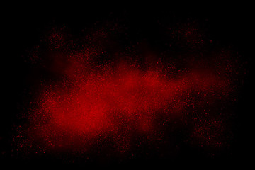 Red abstract powder explosion on a black background - obrazy, fototapety, plakaty