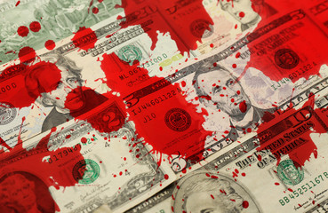Money banknotes with bloodstains