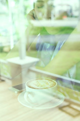 female drinking hot coffee in cafe