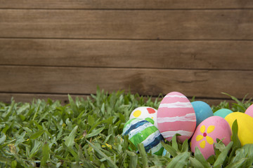 Easter eggs and  in green grass.