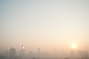 Fototapeta na wymiar smog cityscape at sunset and blue sky