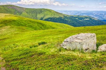 huge stone in valley on top of  the hill