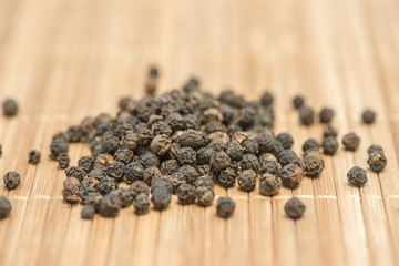 Black pepper, Close-up black pepper on a wood table