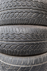 Close up stacks of old used tires. Texture