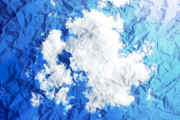 Obraz premium Vintage clouds and sky on crumpled paper texture.