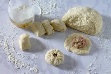 Open pies with meat (belyashi) - the cooking process. Forming th