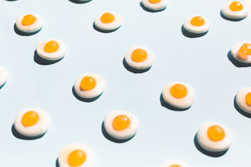 contemporary still life of a group fried eggs candy, colorful pop concept